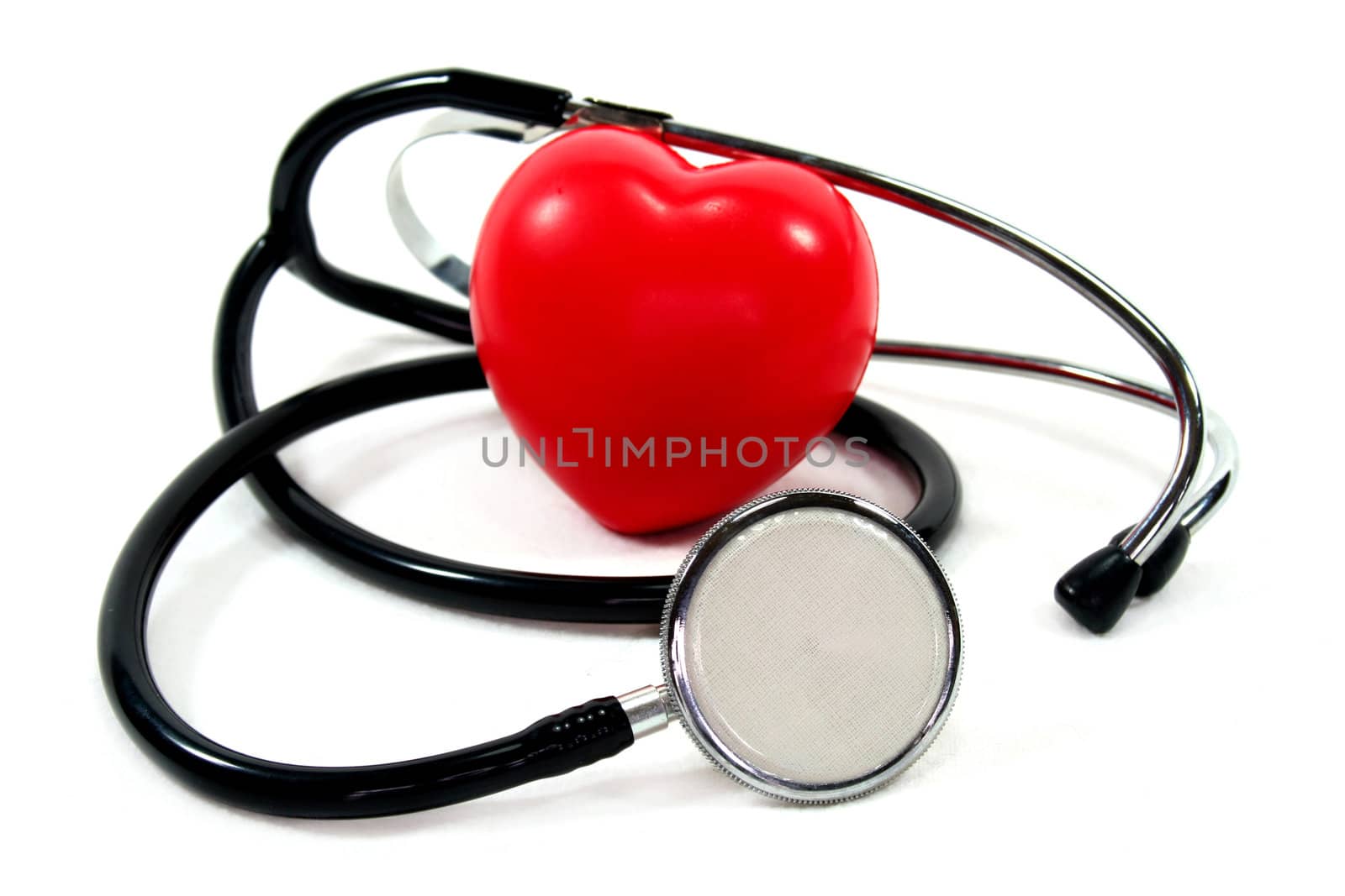 Stethoscope with red heart on a white background