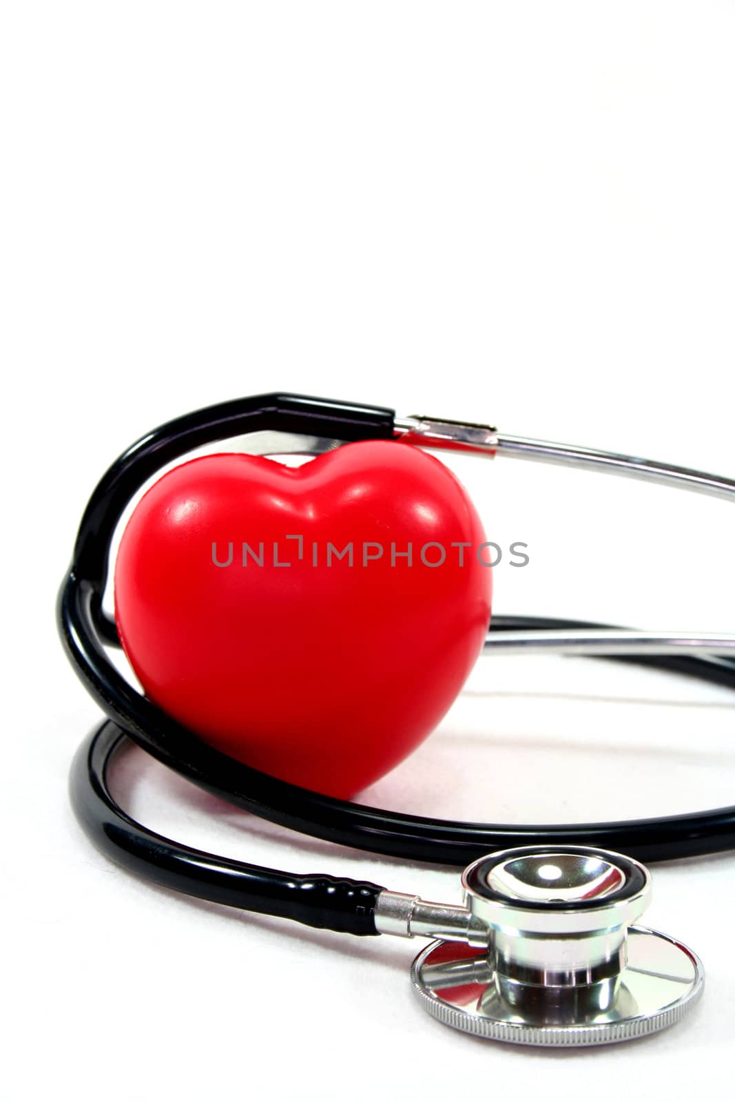 Stethoscope with red heart on a white background