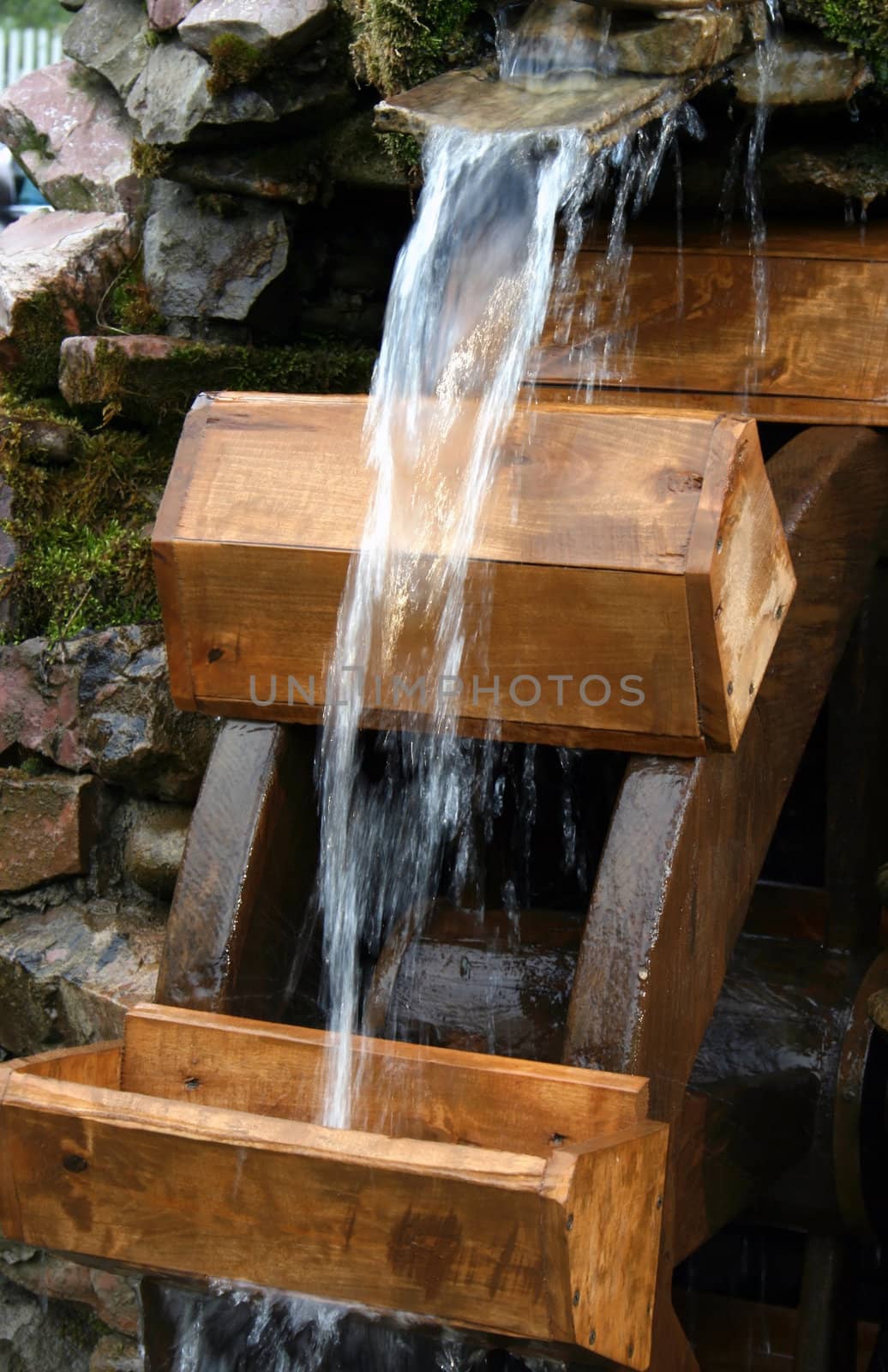 The water stream falls on a water-mill ladle