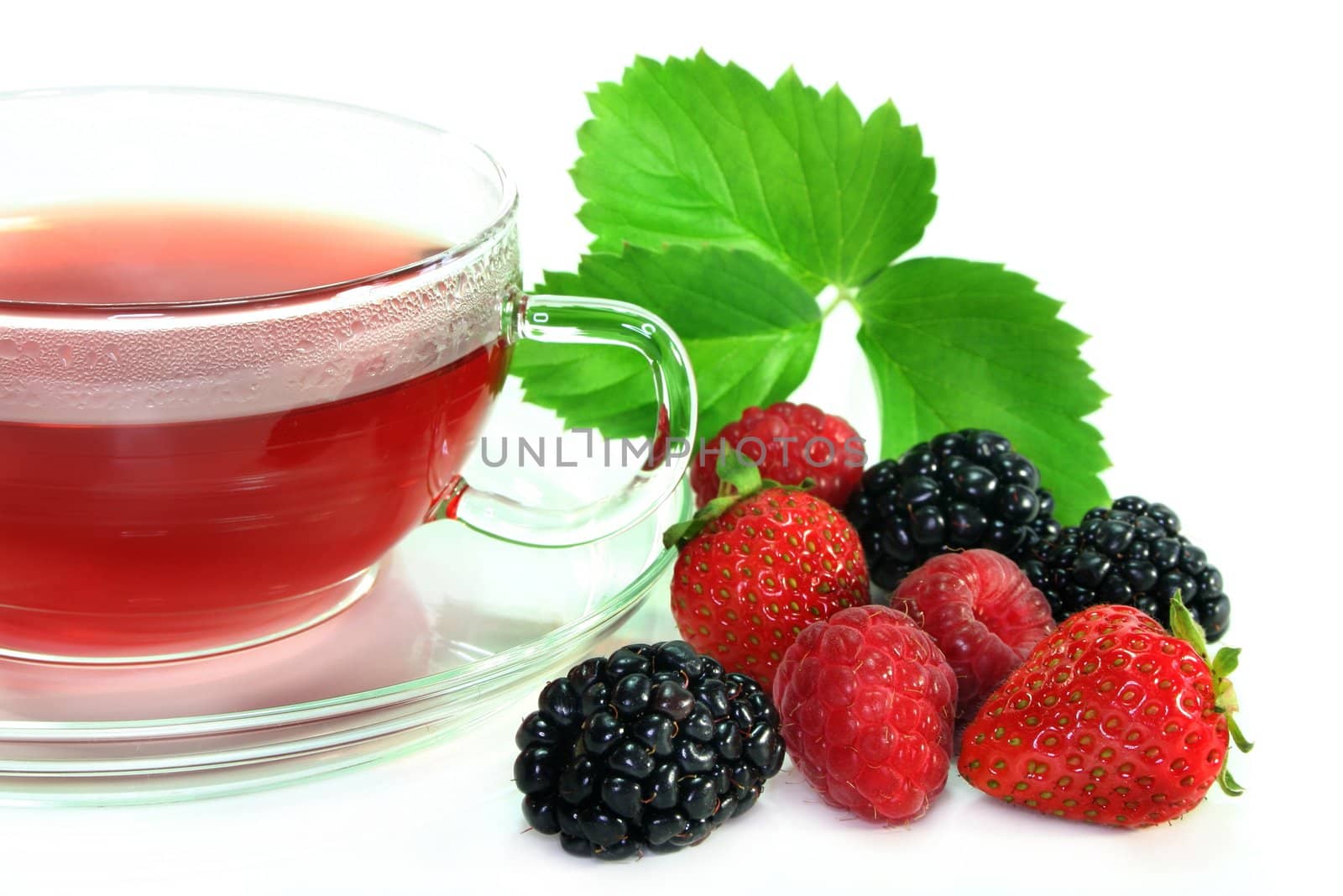 a cup of tea forest fruit with fresh fruit