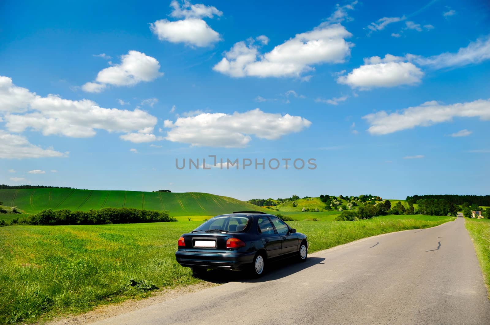 Car is parked in road side with beautiful landscape