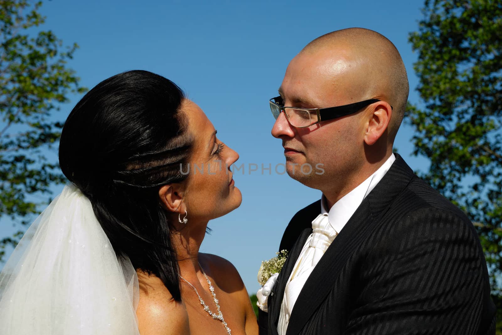 Bride and groom are looking at each other