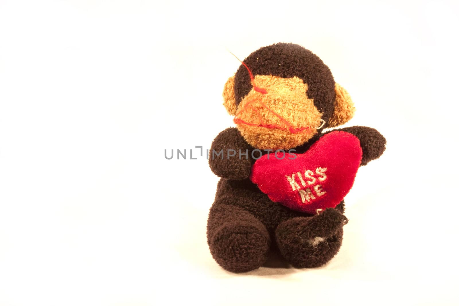 A toy monkey with a heart