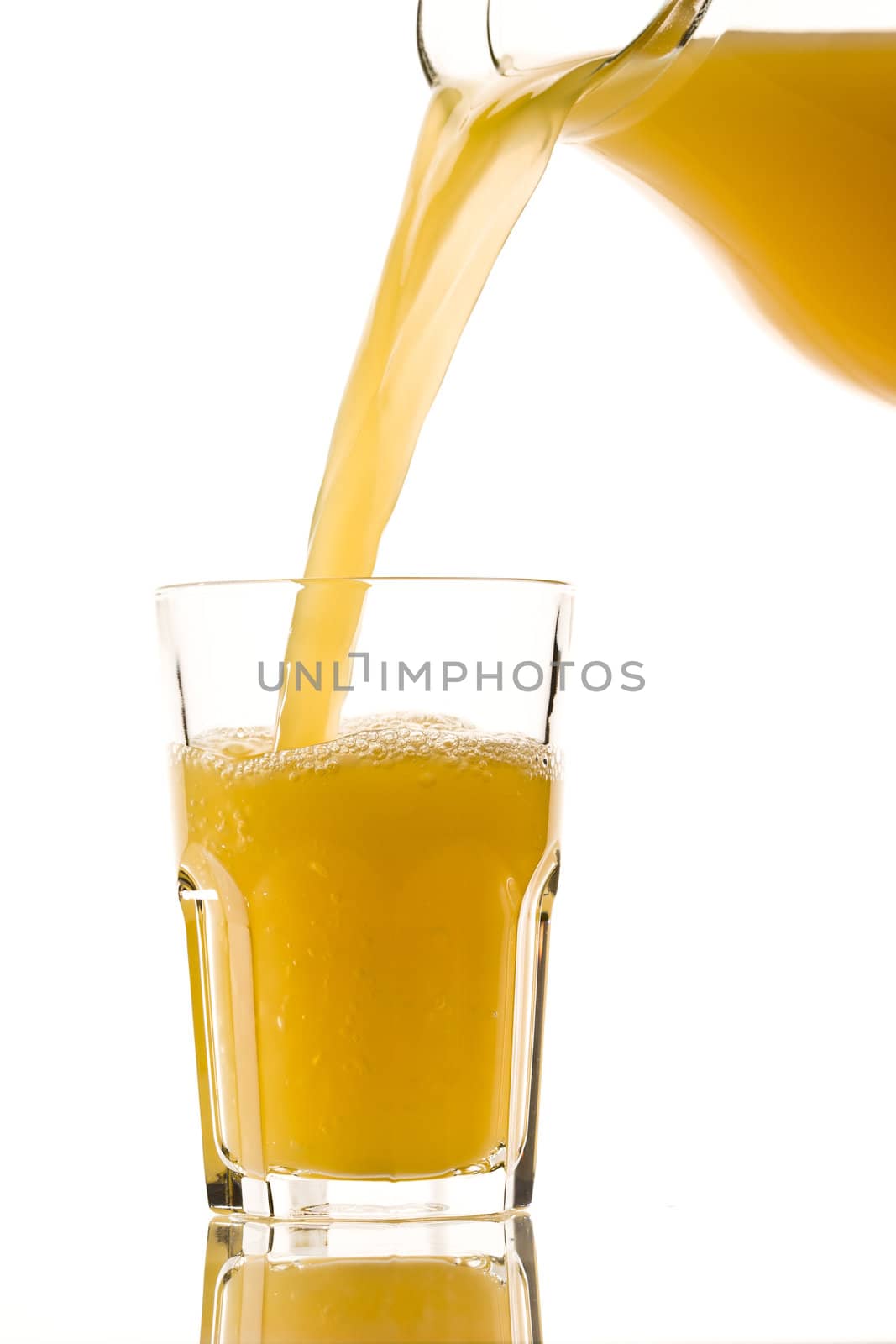 drink series: orange juice flowing from jug