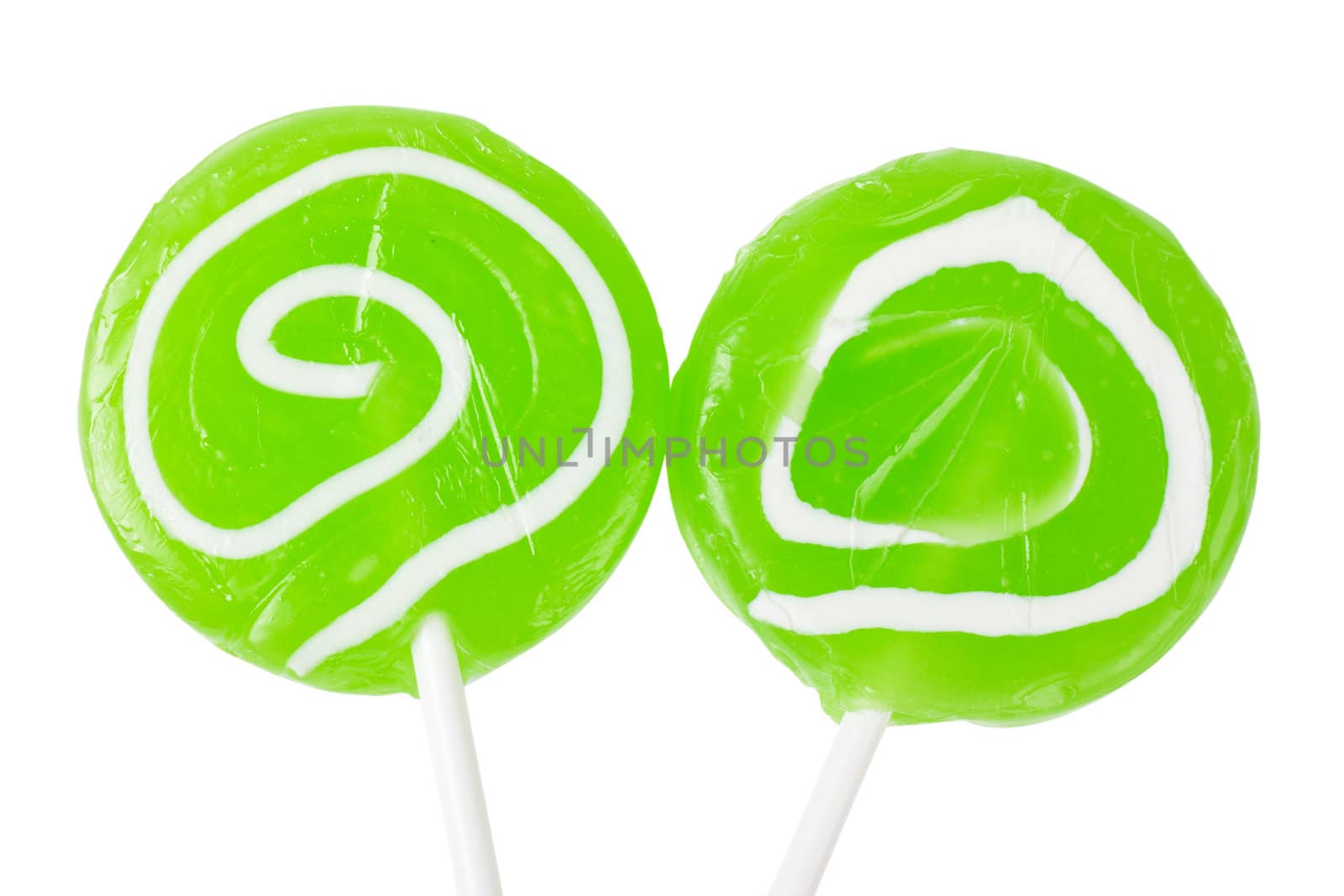 Macro view of two green lollipops isolated over white background
