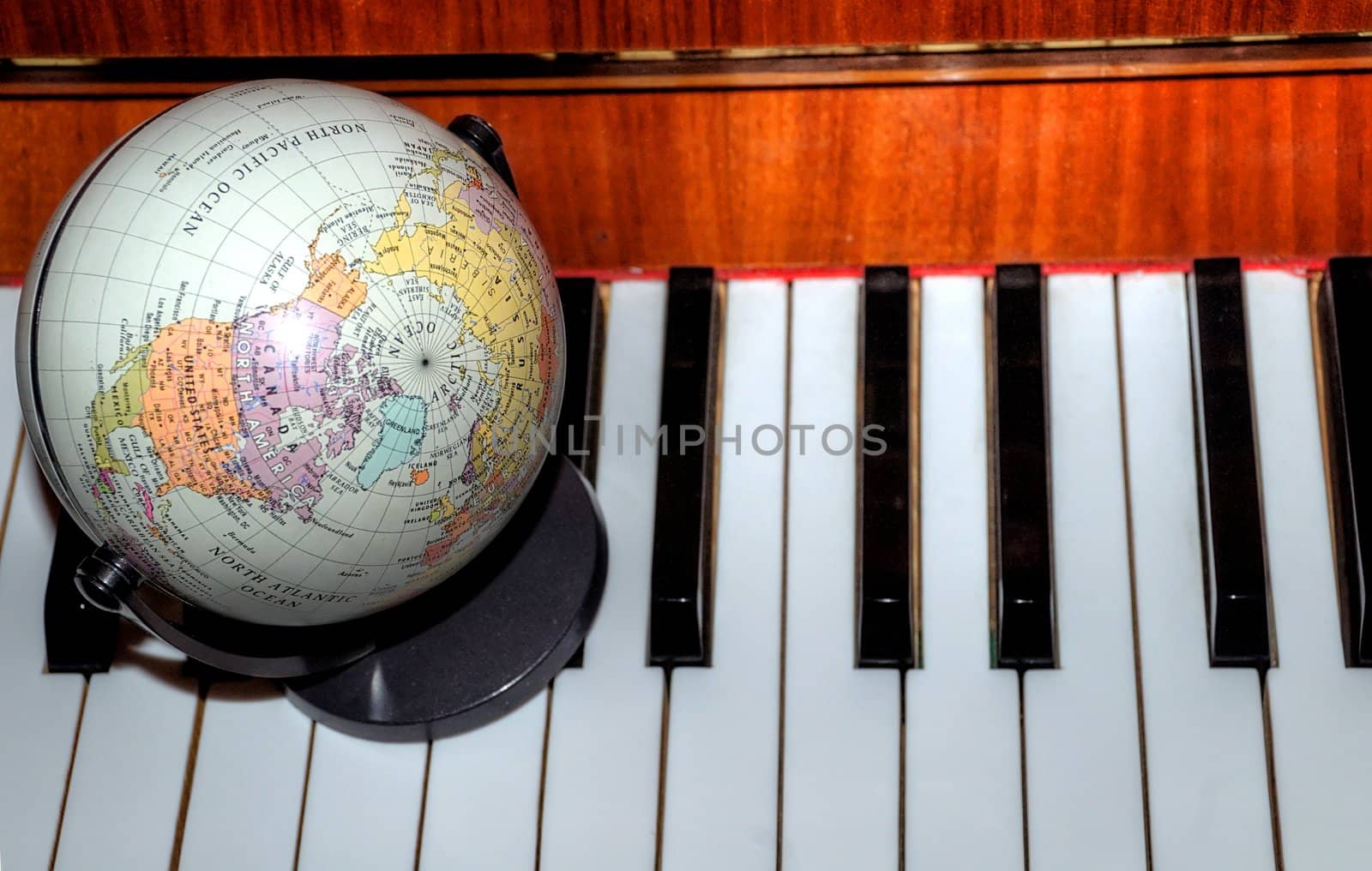 globe on piano; concepts; worldwide concert; global sales;