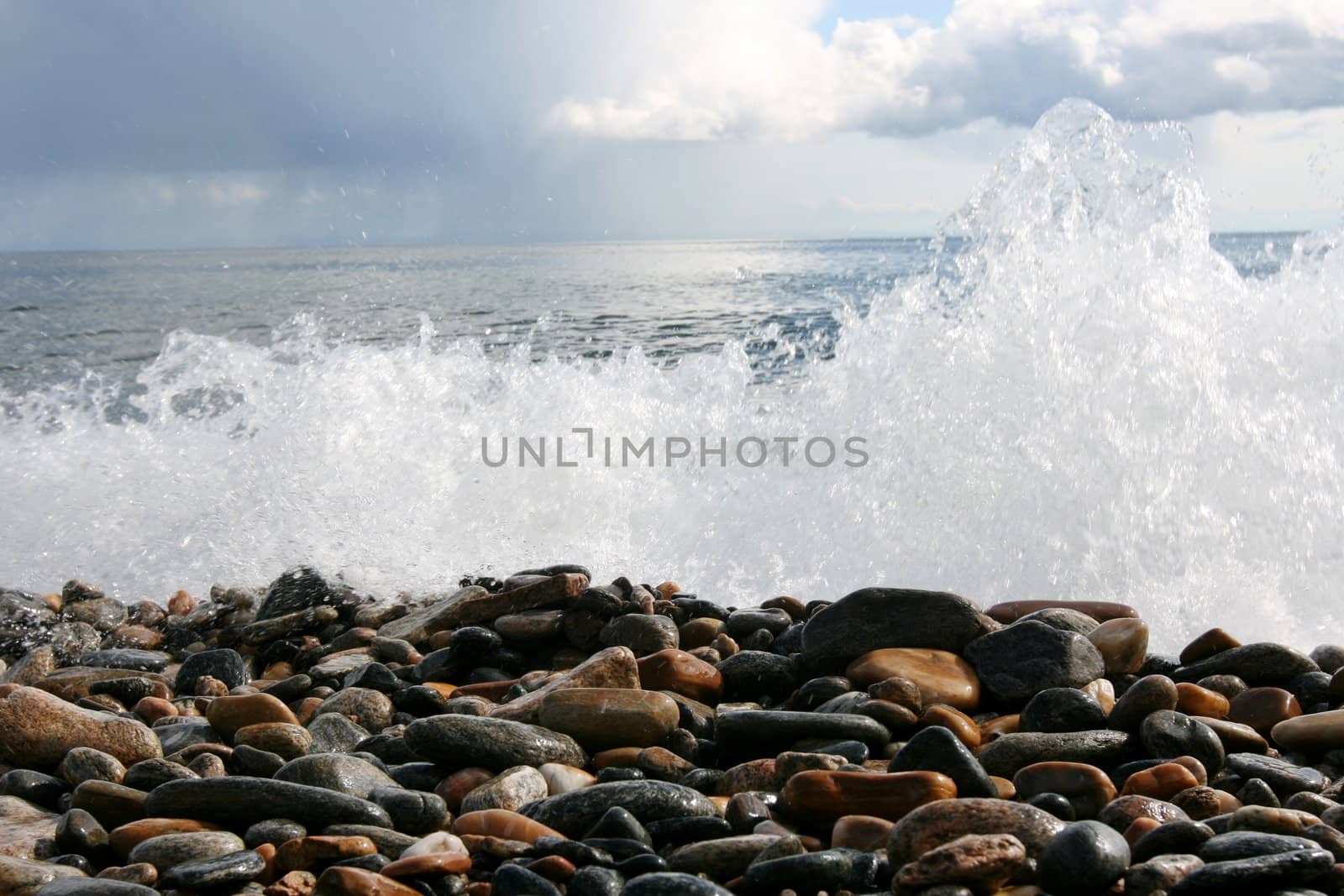 Water wave over rocks	