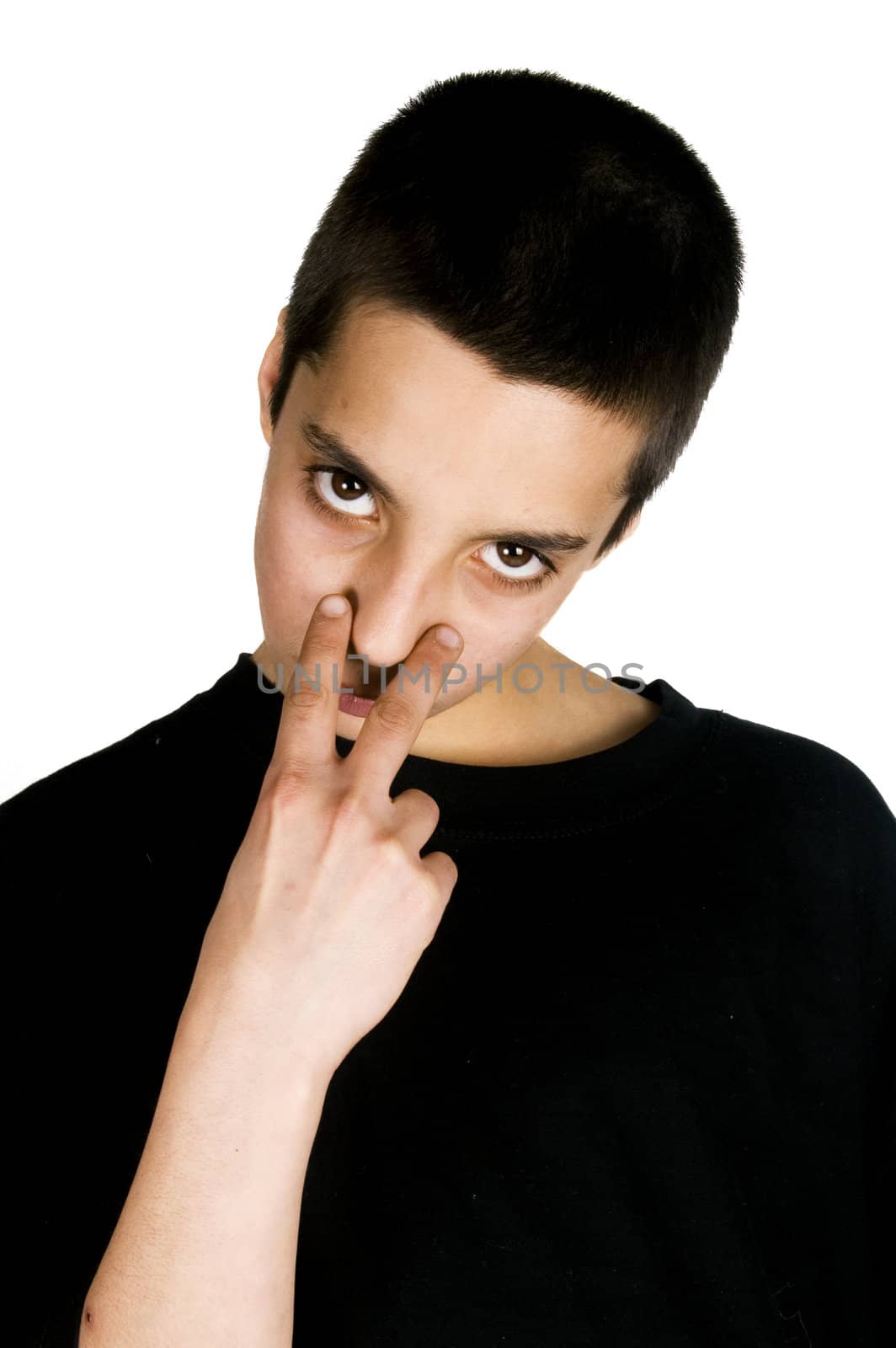 young teenage boy pointing to his eyes