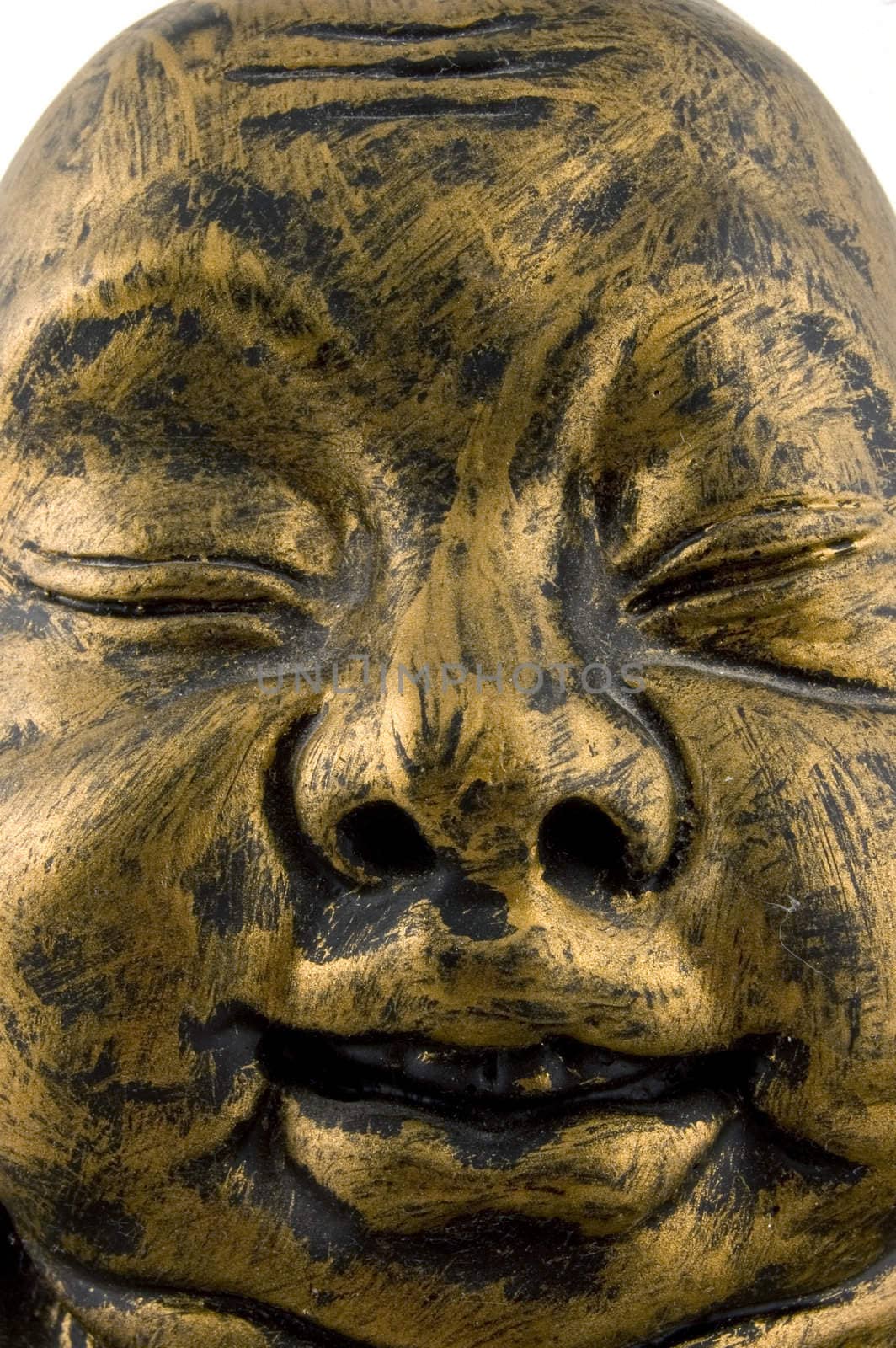 close up of golden buddha face by ladyminnie