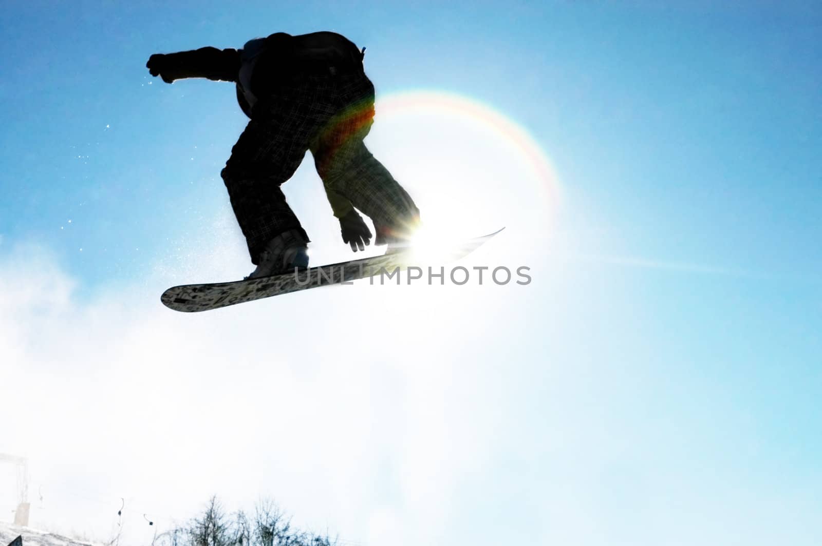 A snowboarder going big high above the half pipe                                     