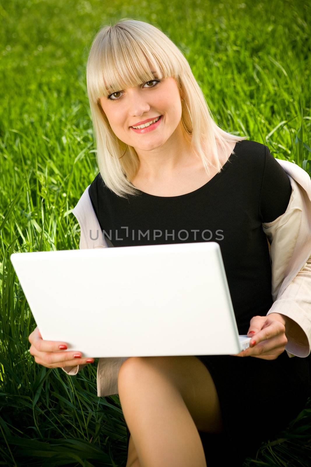 portrait of smiling girl with laptop