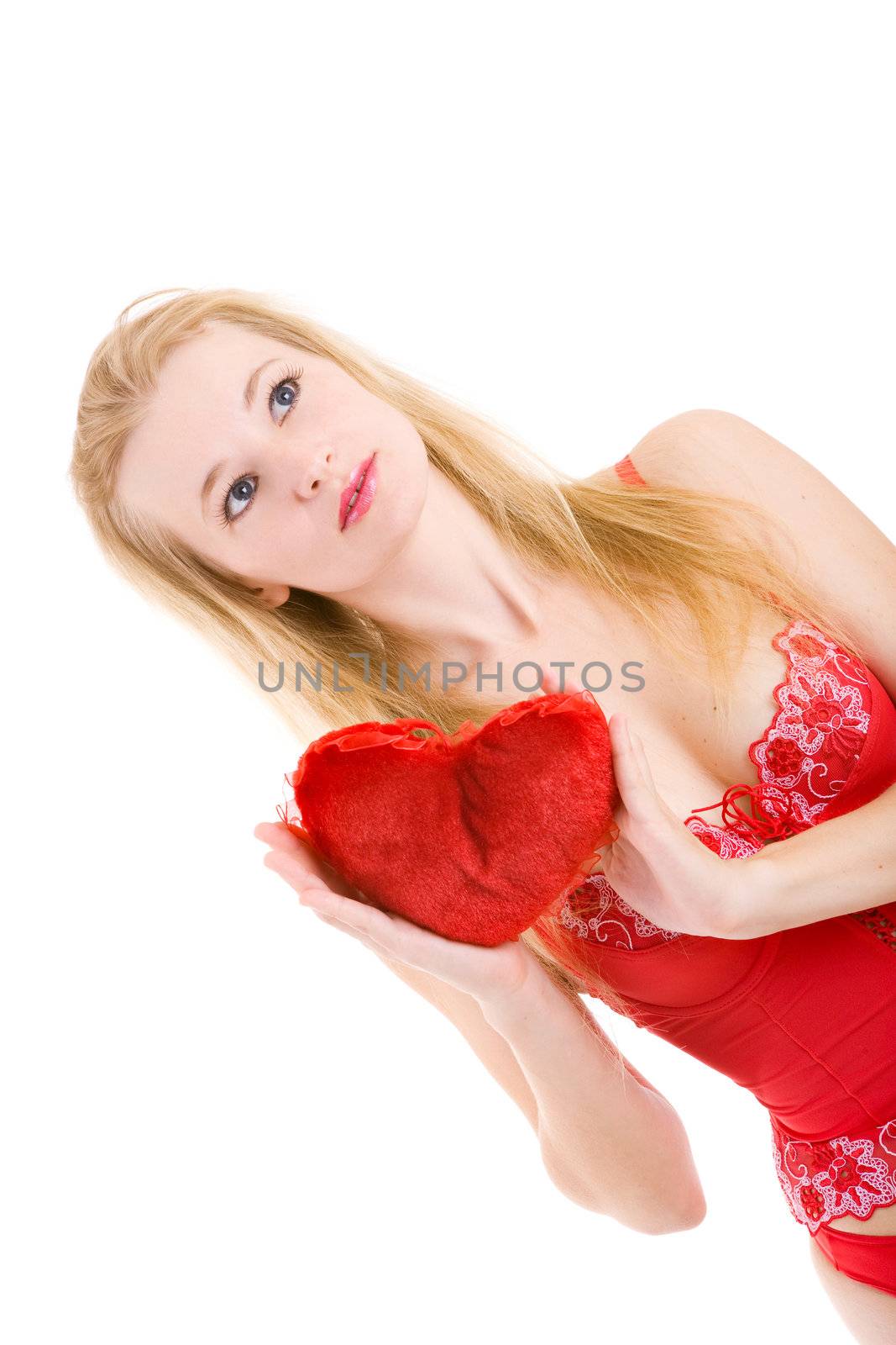 pretty blond girl with a red pillow heart