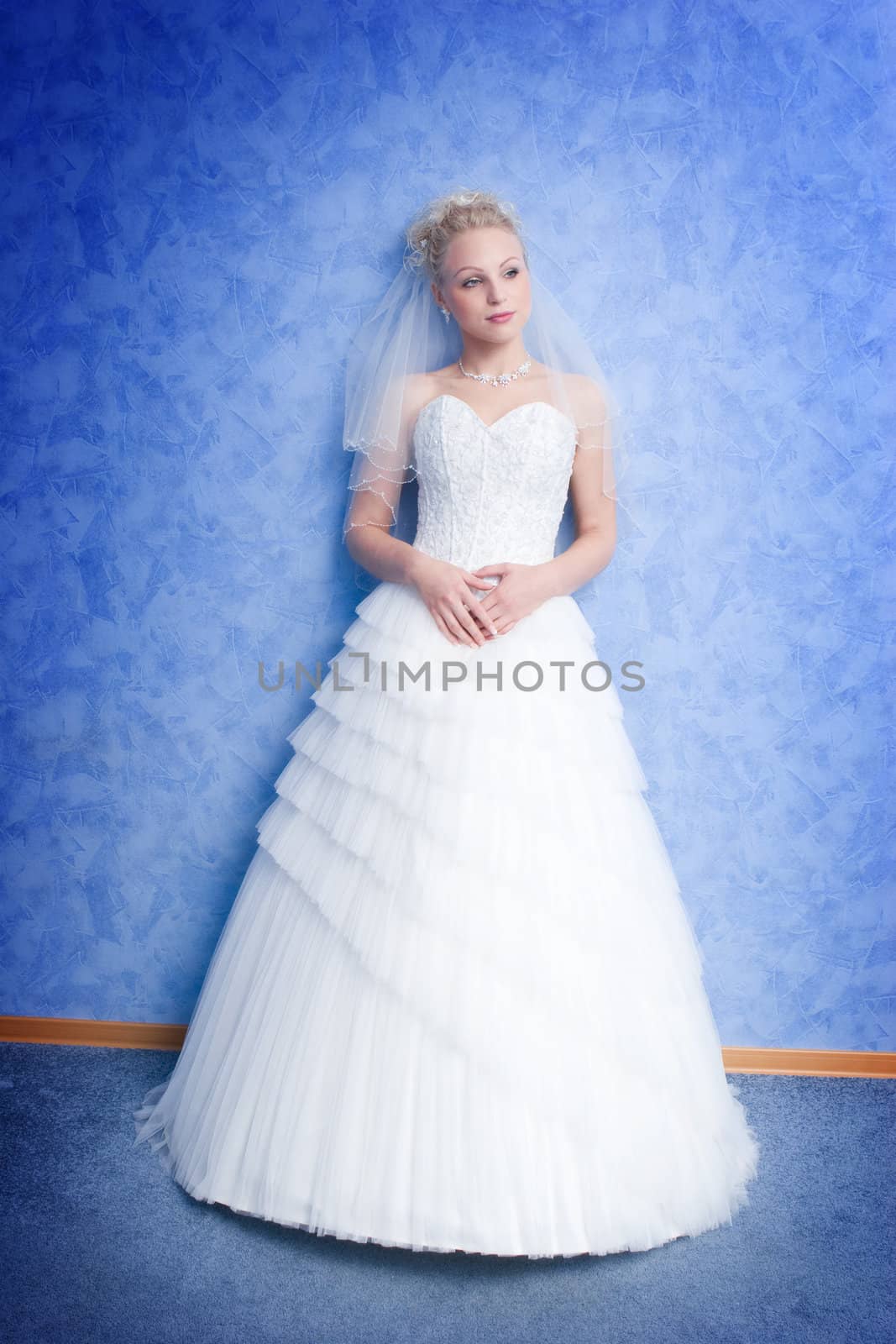 pensive bride on the blue background