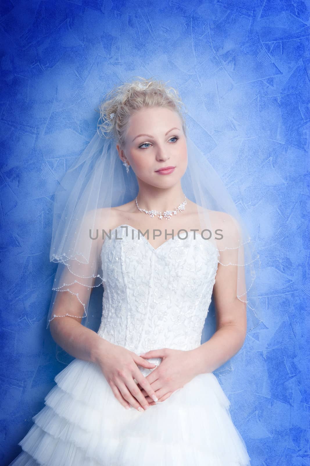 pensive bride on the blue background