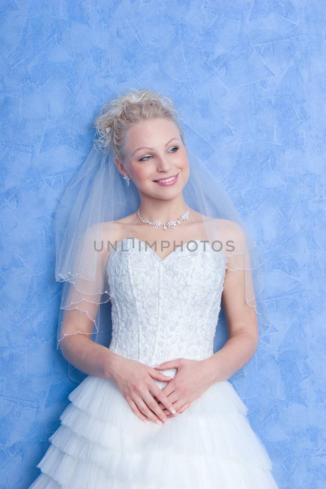 smiling bride on the blue background