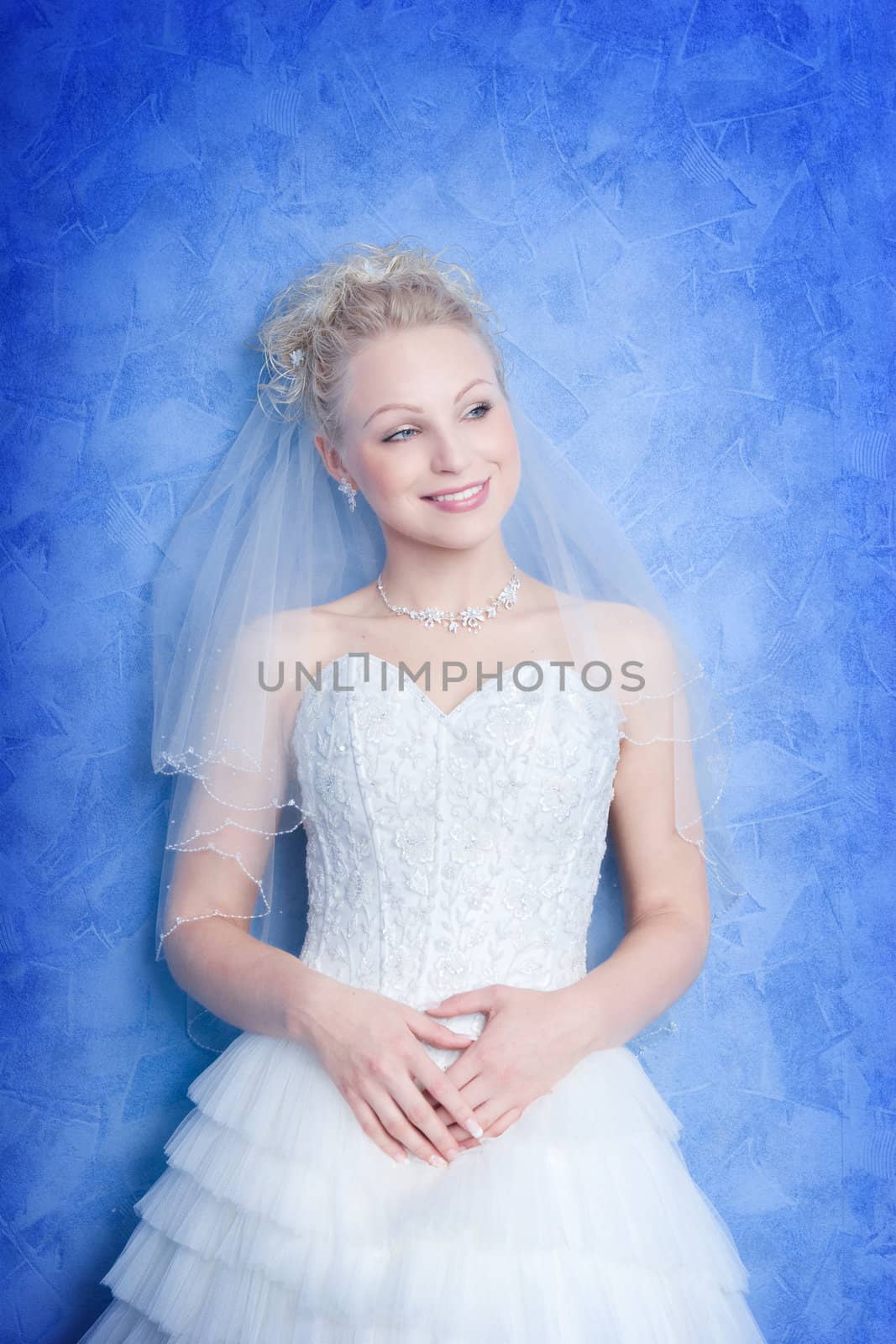 smiling bride on the blue background