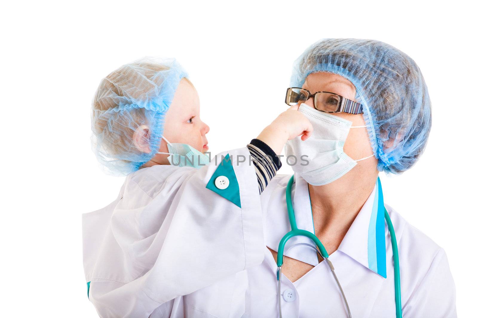 small girl dressed as a doctor in the hands of her grandmother - the medical worker