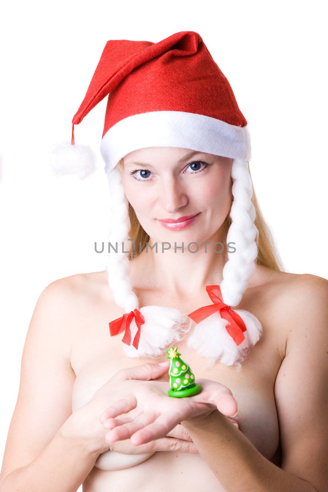 Naked woman in red Christmas cap with contraceptive