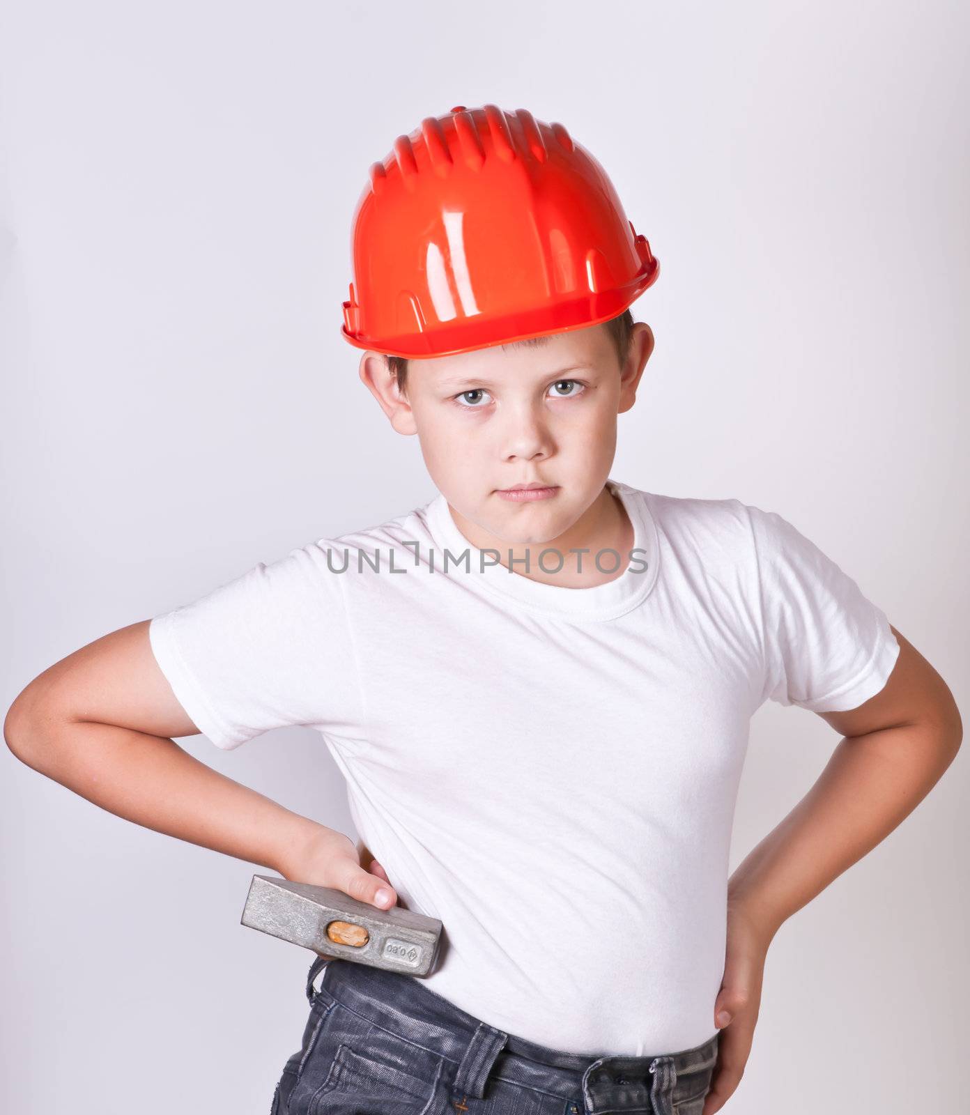 Portrait of a boy in a red protective helmet