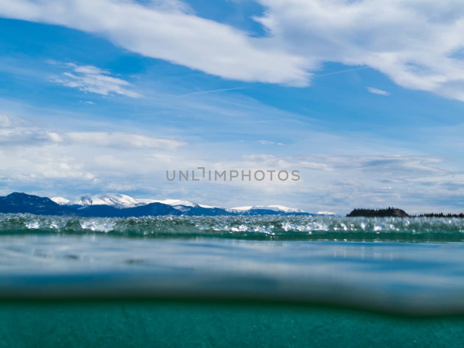 Melting ice-cover of large Lake Laberge, Yukon Territory, Canada, seen partly from underwater.