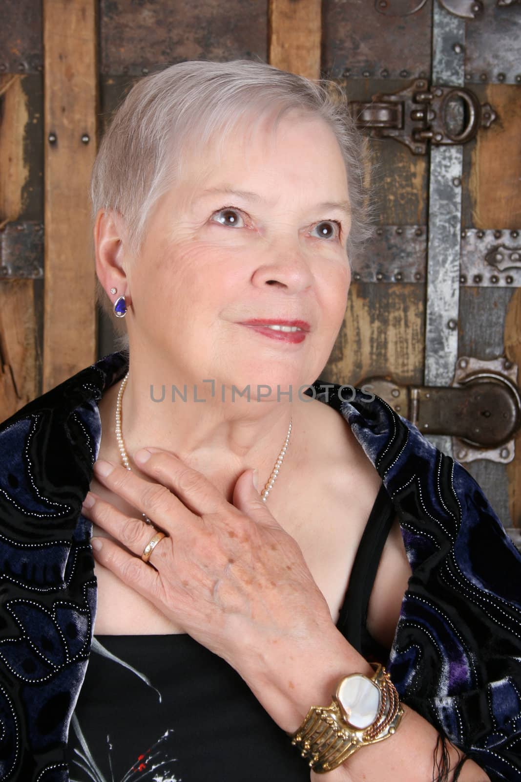 Elegant female wearing antique jewellery and pearls