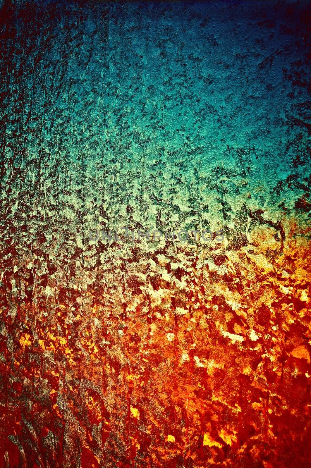 Background a texture. A winter window become covered by patterns from colour ice