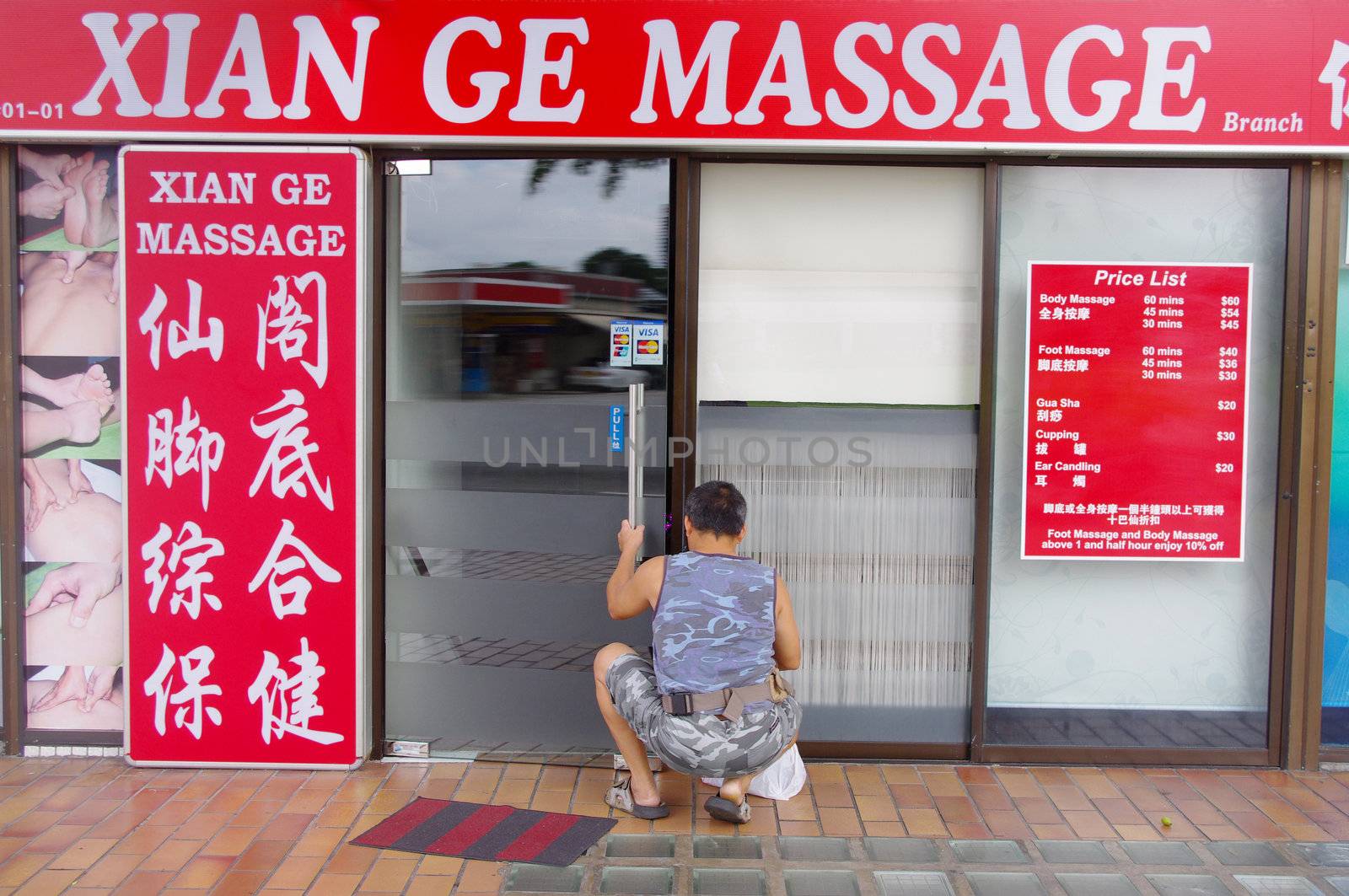 Massage and reflexology parlour in Singapore. Wellness tourism is now big business in Asia, with numerous Spas, saunas and massage parlours.