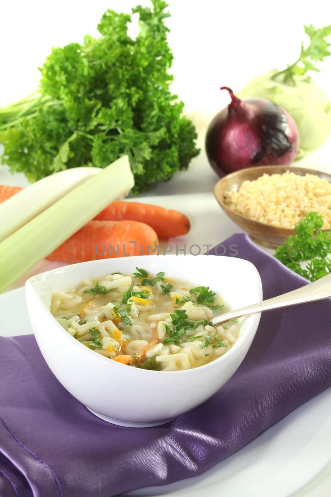 Alphabet soup with carrots, leeks, onions and parsley