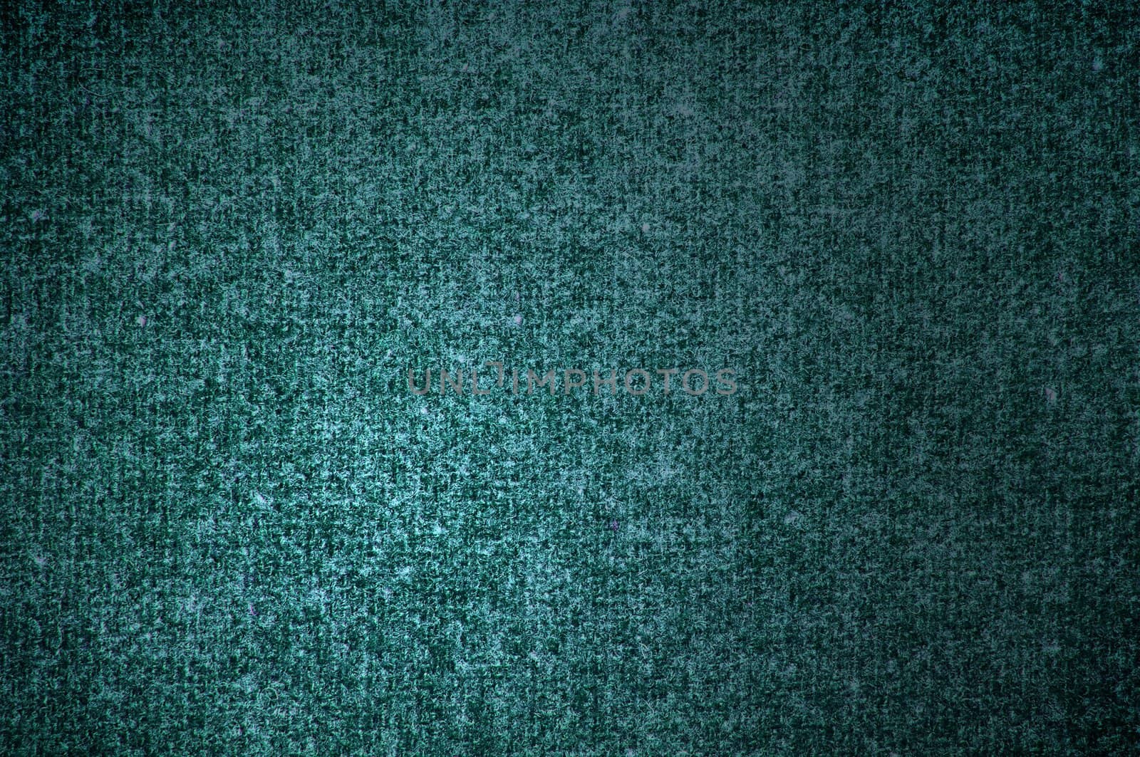 Background a texture a knitted woolen fabric of dark green color