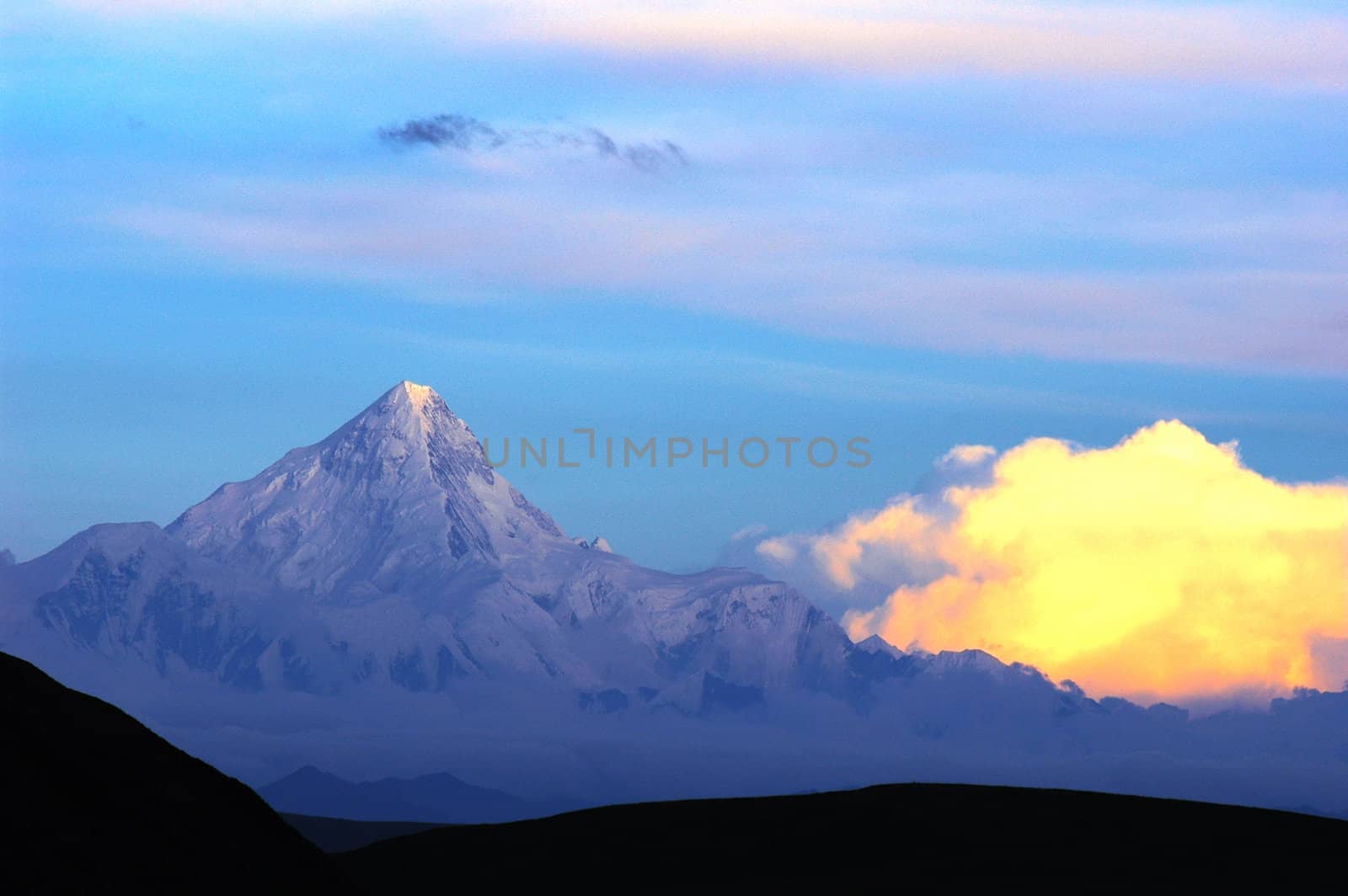 Landscape of snow-capped mountains of Gongga in Sichuan, China at sunset