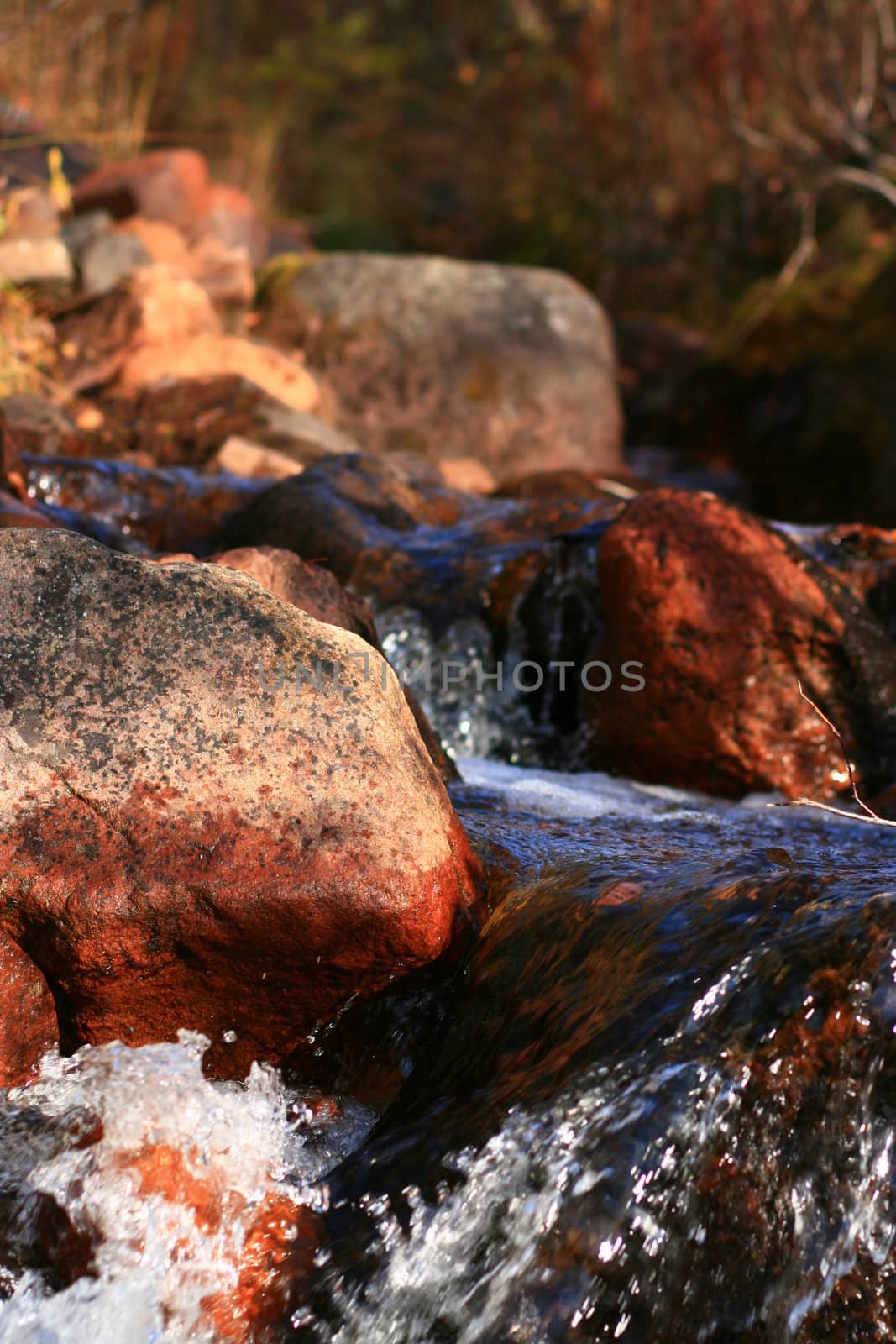 Stones in a small waterfall by steelneck