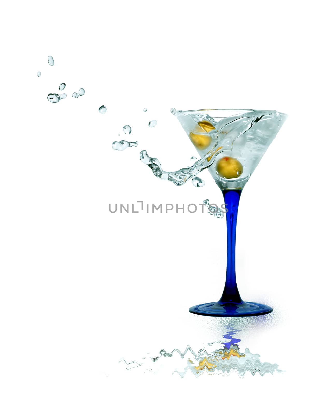 Nice martini glass with splashing beverage and green olive. Isolated on white with clipping path