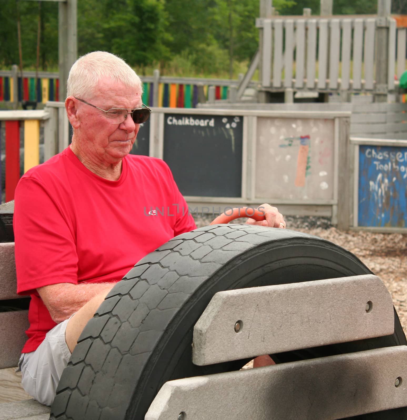 Man in playground car