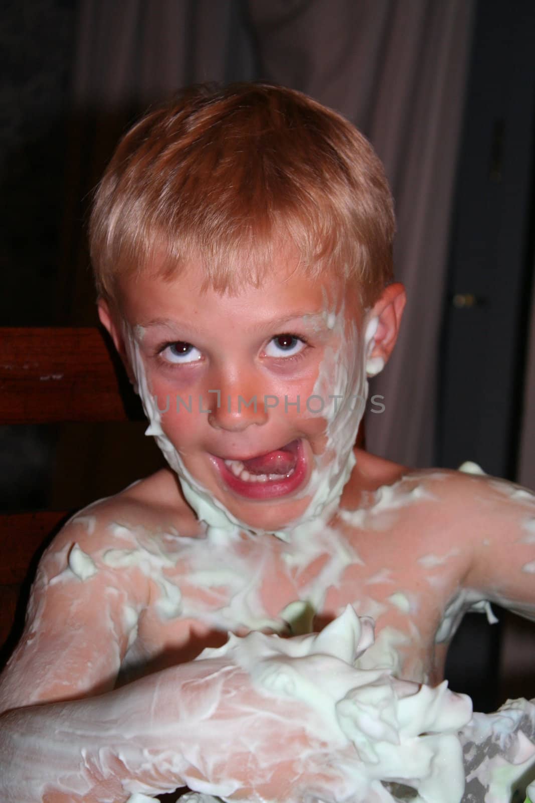 Young boy with shaving foam