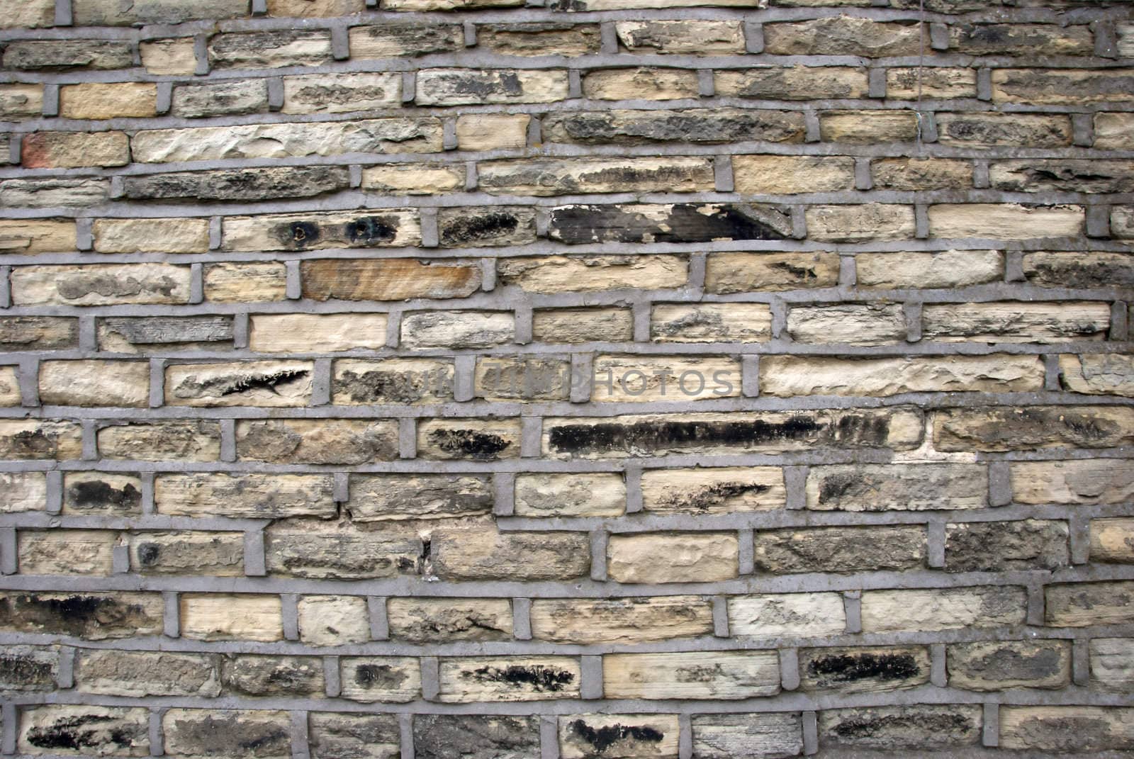 A wall of Yorkshire Stone with cement pointing