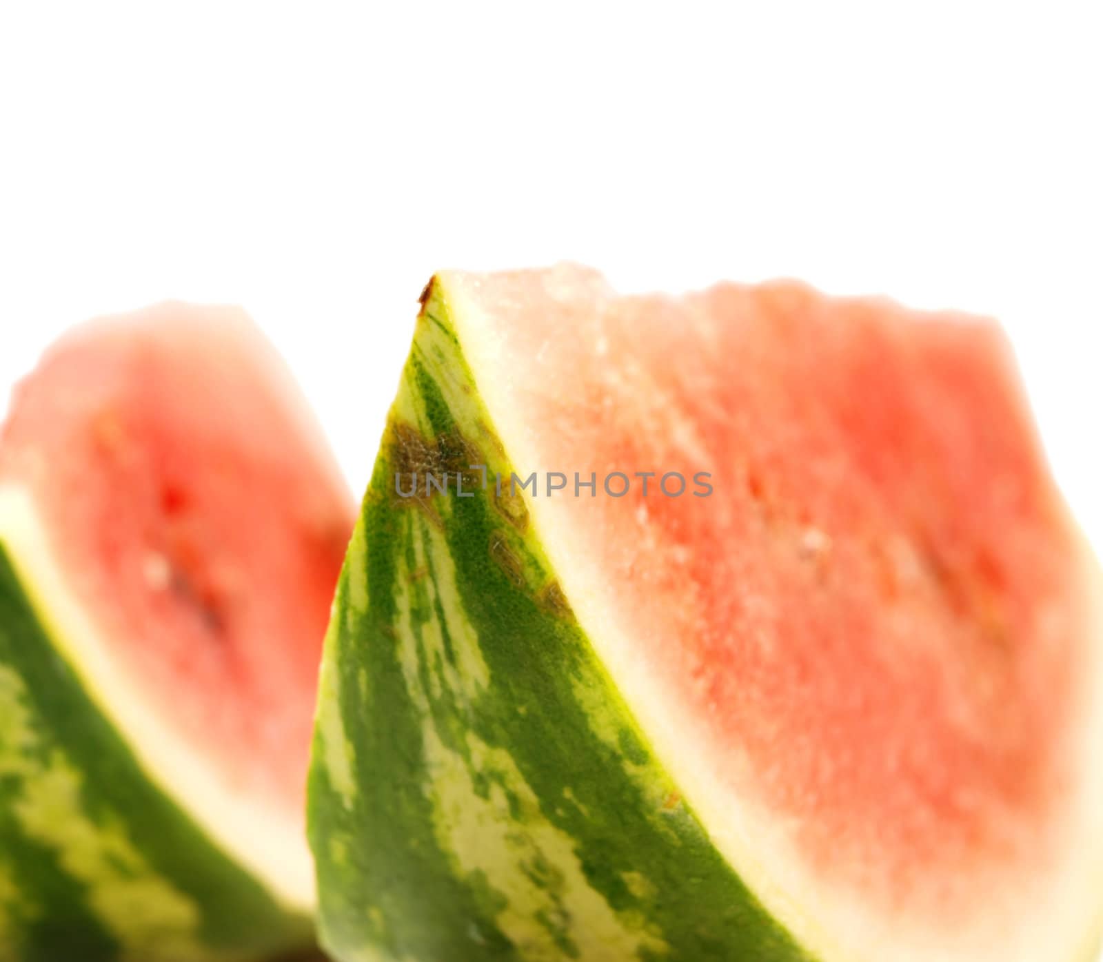 Red watermelon in slices towards white background