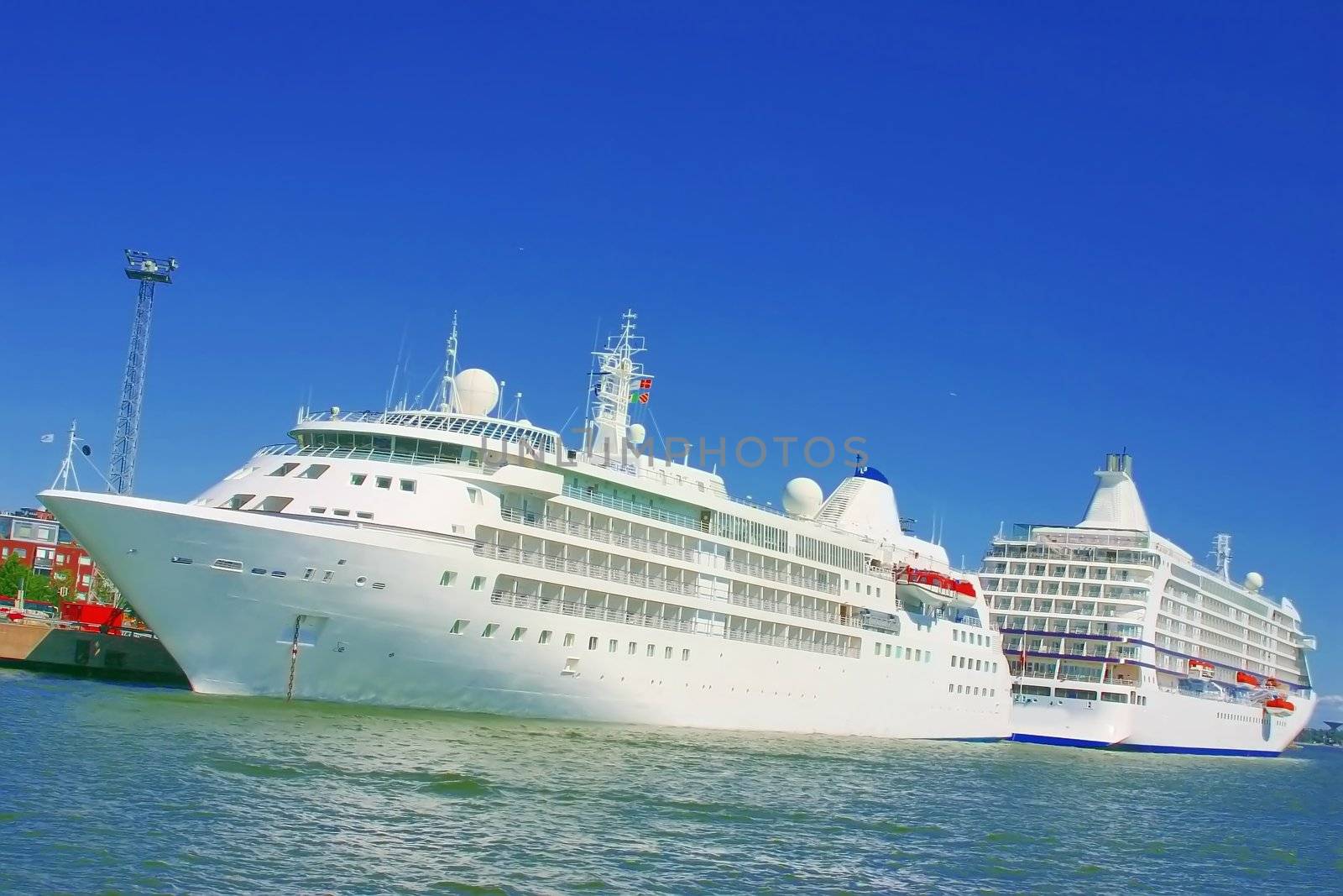 Two cruise ships, at harbor