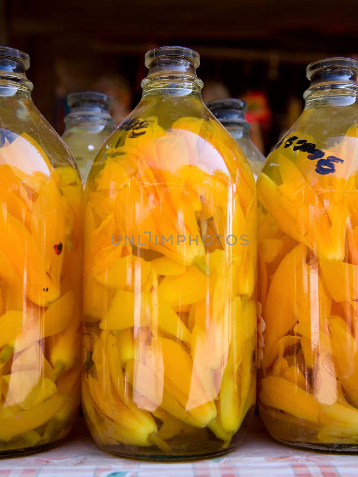 bud of yellow flowers  in transparent glass bottle