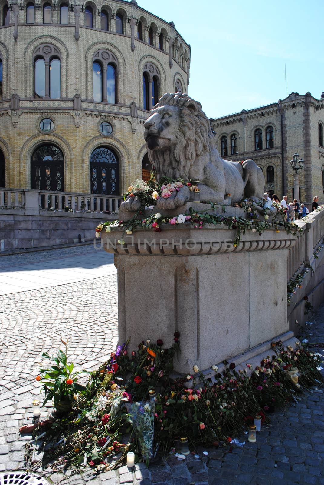 Flowers by the national lion at the norwegian parliament (Stortinget), in memory of the victims of the terror attack 22.07.2011.