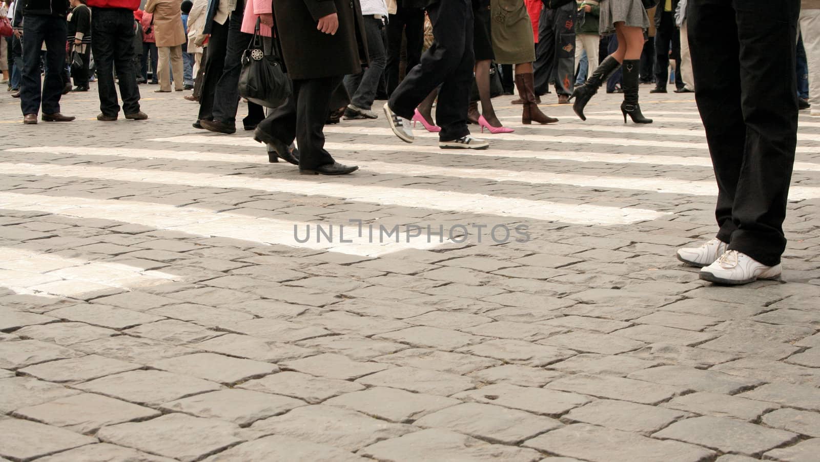 Feet of people going on Red Area in the day of Victory