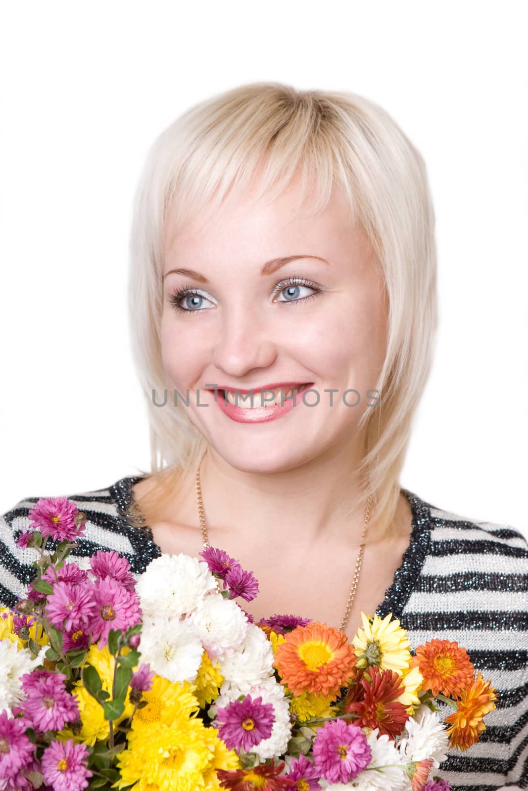 portrait of the smiling blond girl with flower bouquet