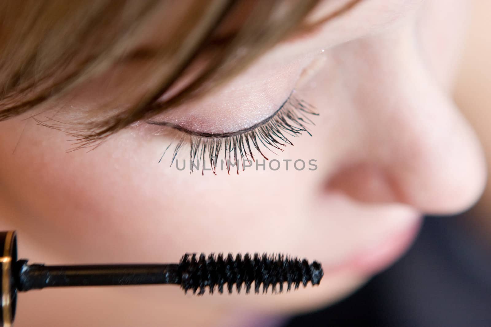 young woman directs a make-up in the morning
