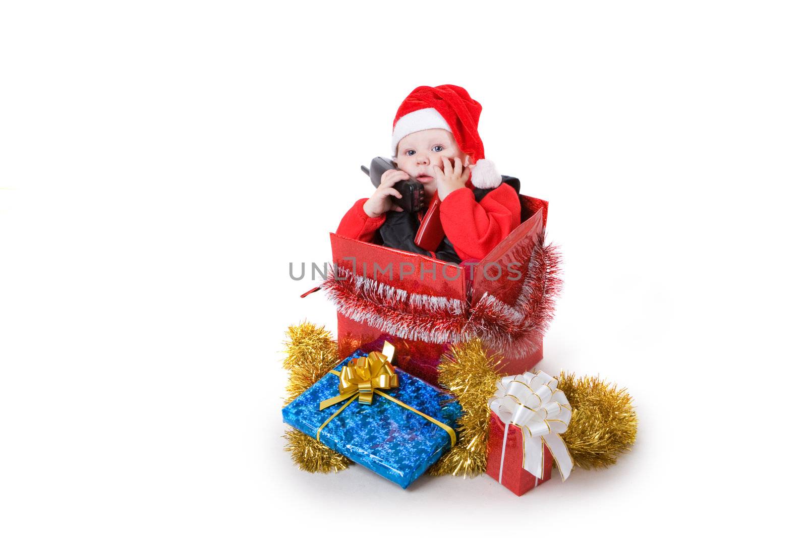 infant calling by phone in the decorated christmas box