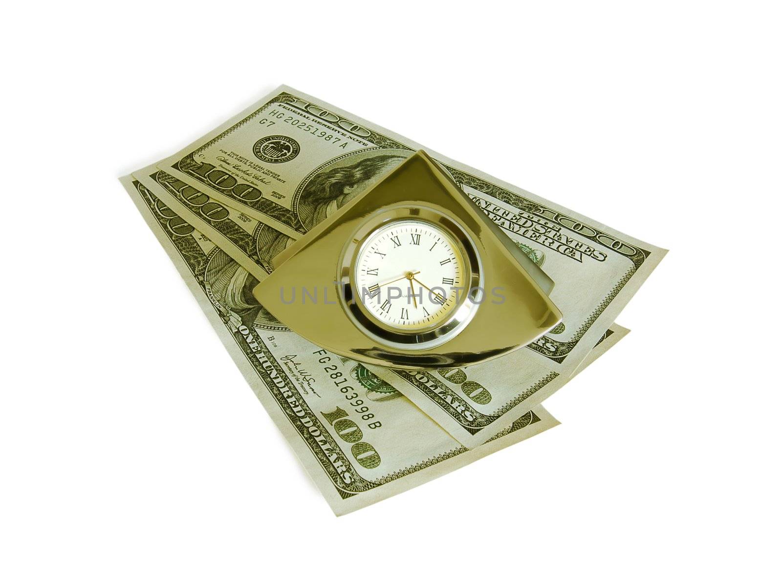Objects on the white. A bracket clock over money.