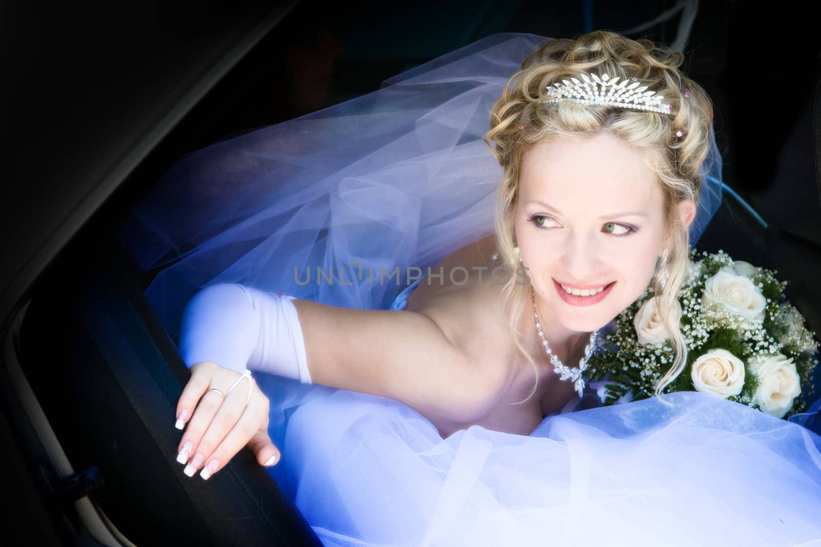 Portrait of the bride sitting in the car by vsurkov