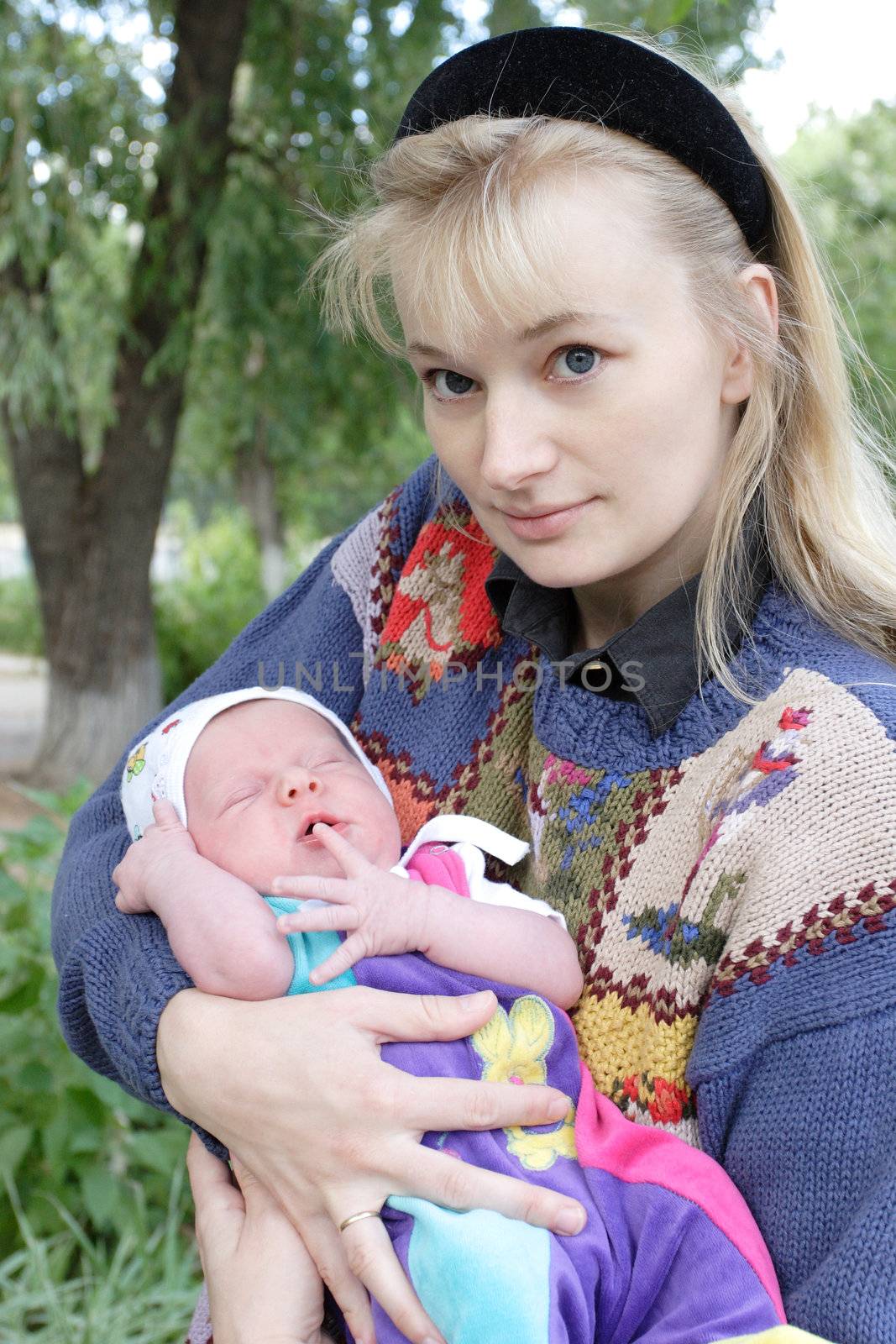 mother with her newborn child in her hands