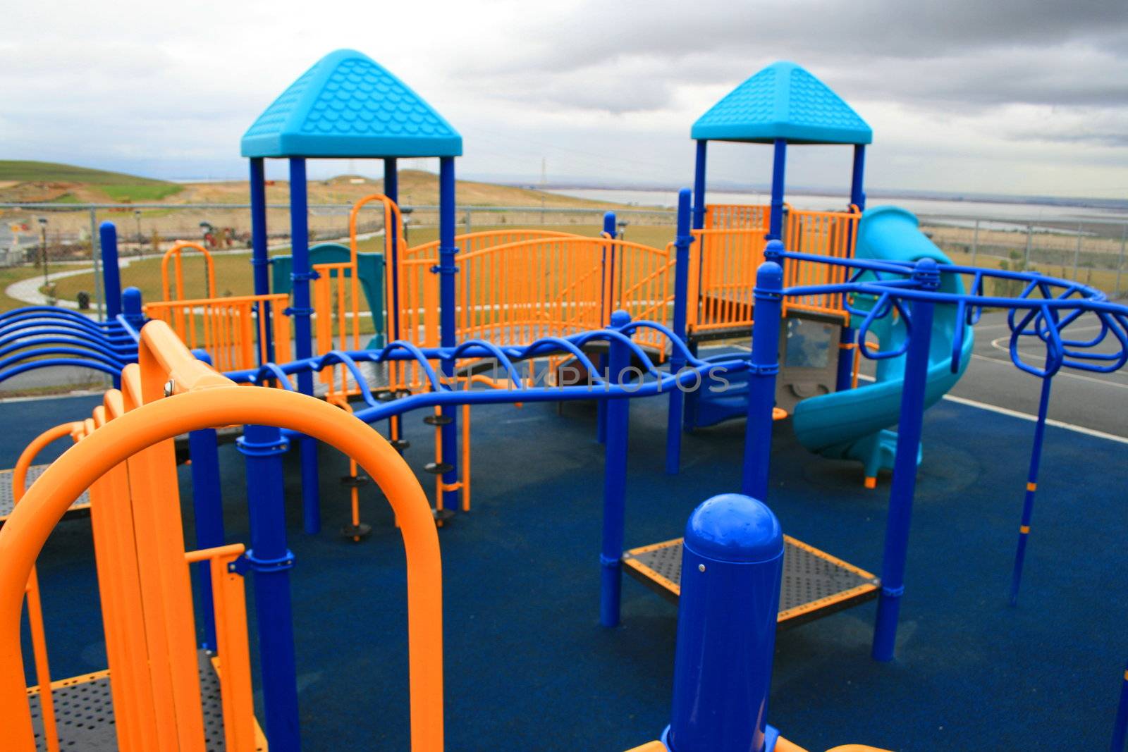 New playground in a schoolyard in summer.
