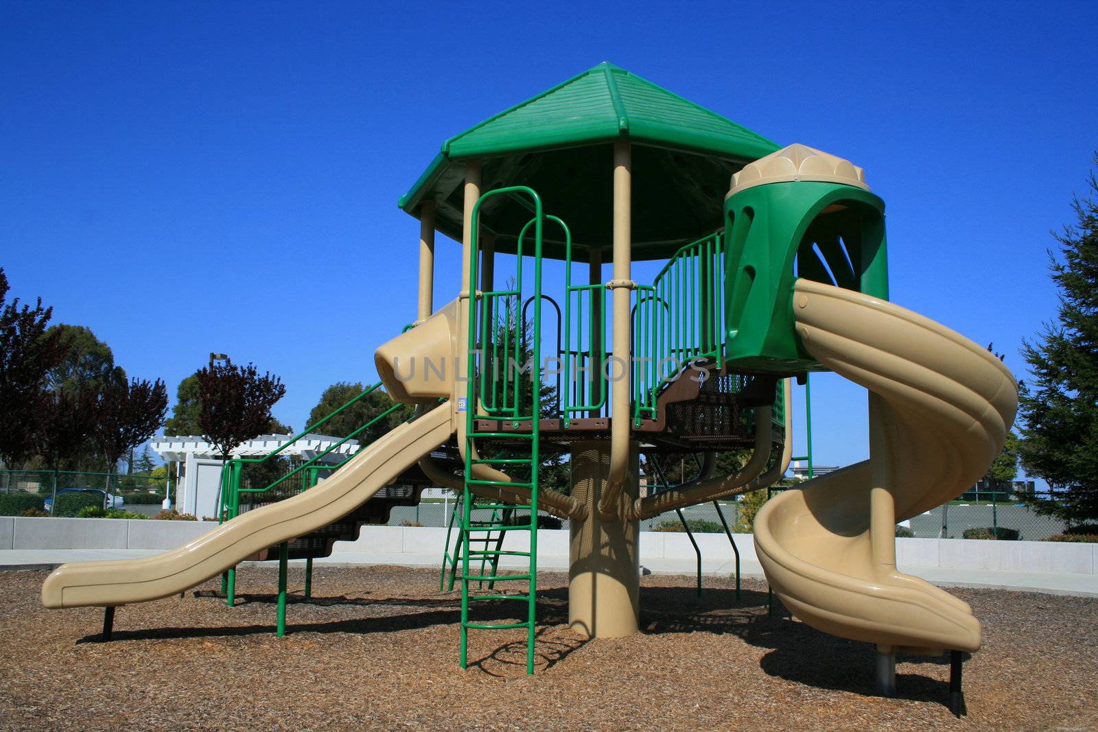 New playground in a schoolyard in summer.
