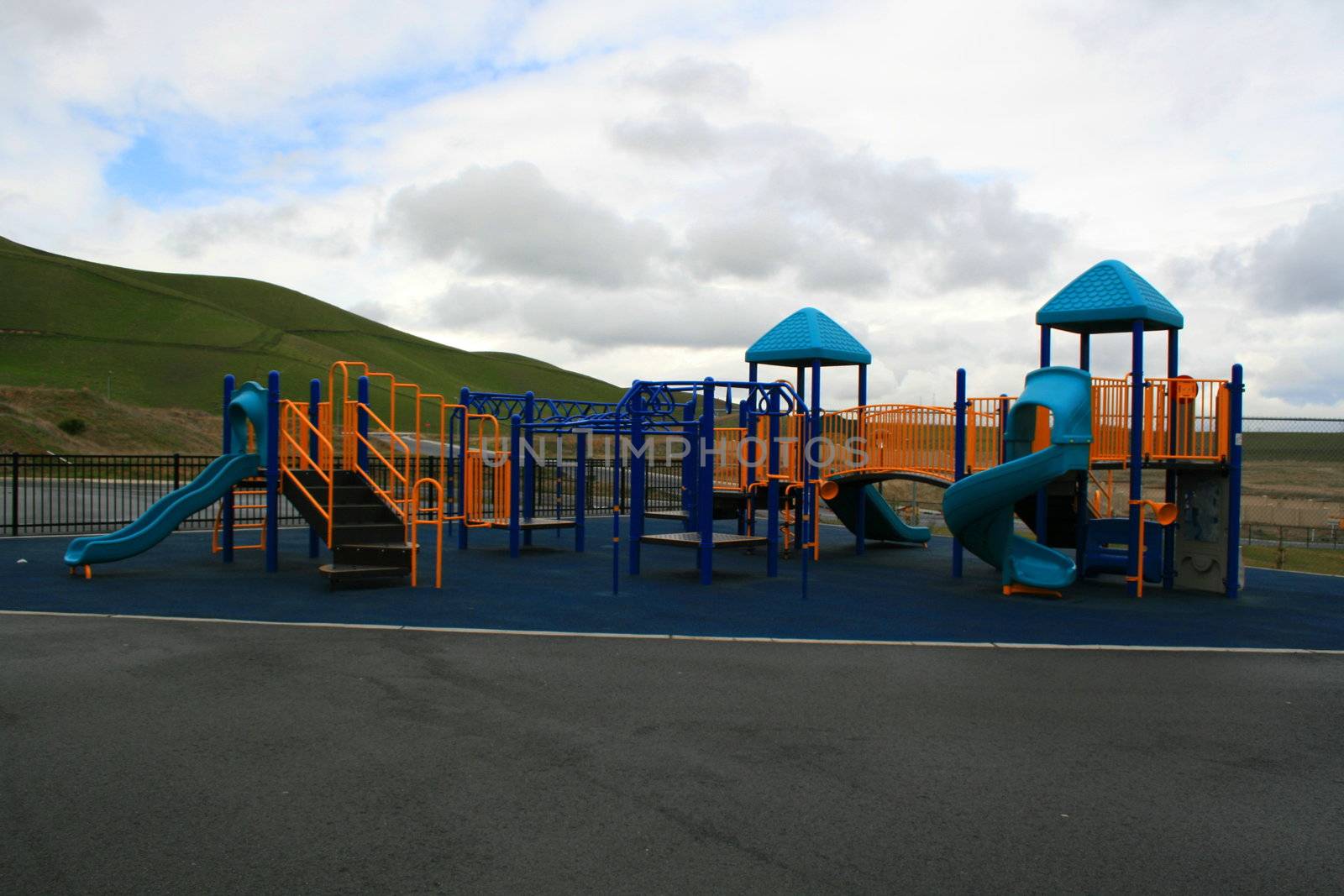 New playground in a schoolyard in summer.
