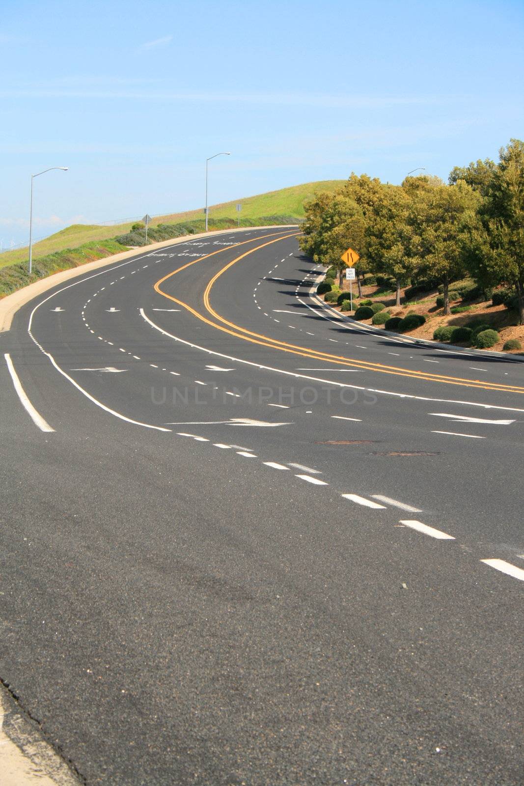 Long infinite road on a sunny day.
